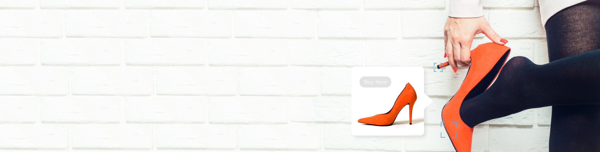 Close up of a hand grasping the heel of a red high heeled shoe and an inset image of the same red shoe in a display ad